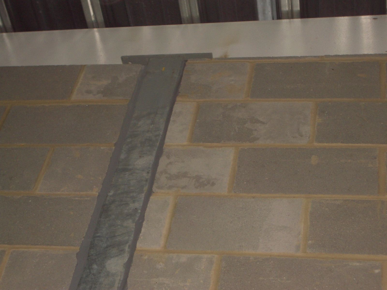 Setting windpost into the wall